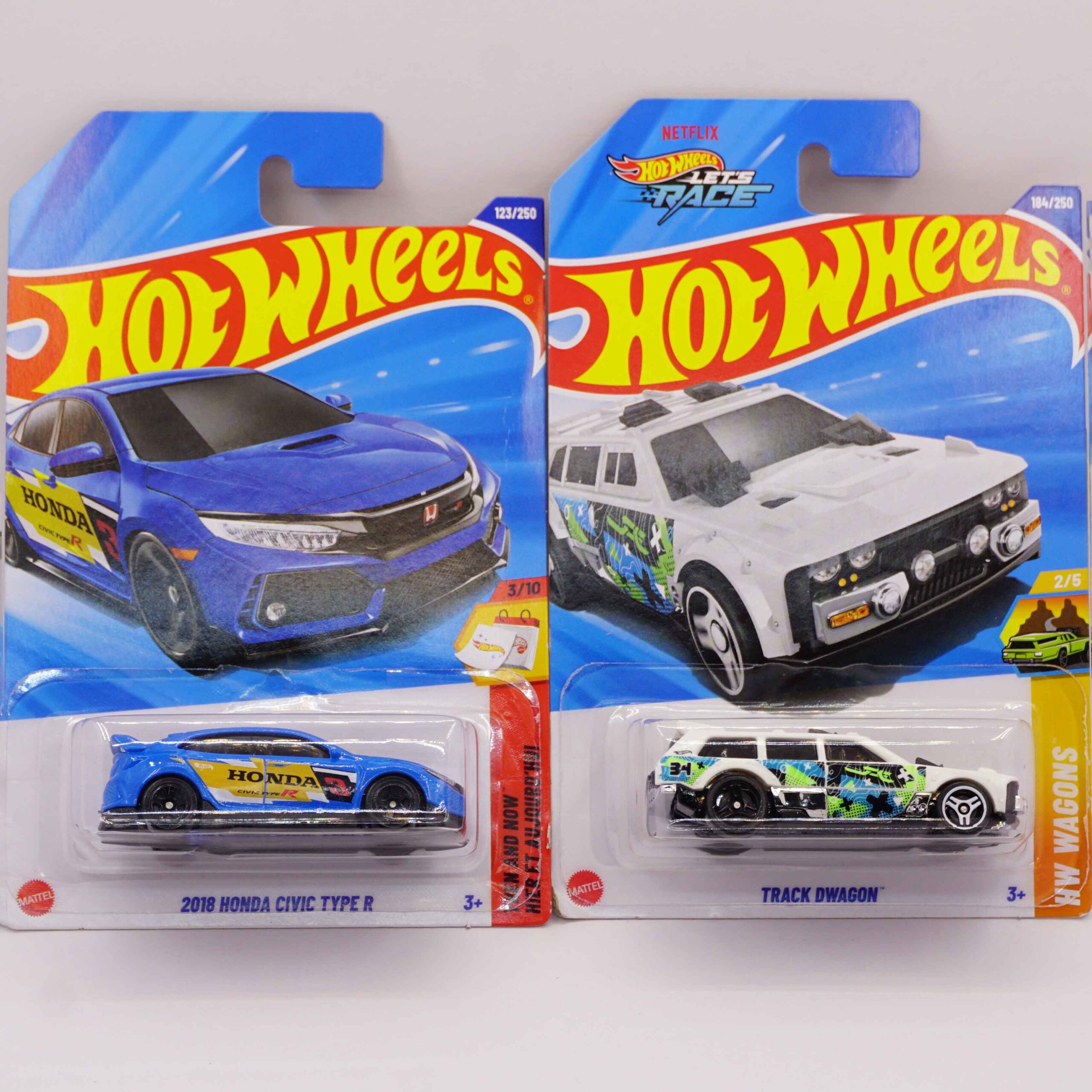 Hot Wheels Mainlines die-cast cars, featuring blue 2018 Honda Civic Type R and white Track Dwagon fantasy wagon, 2025 releases at RACEiN PARC