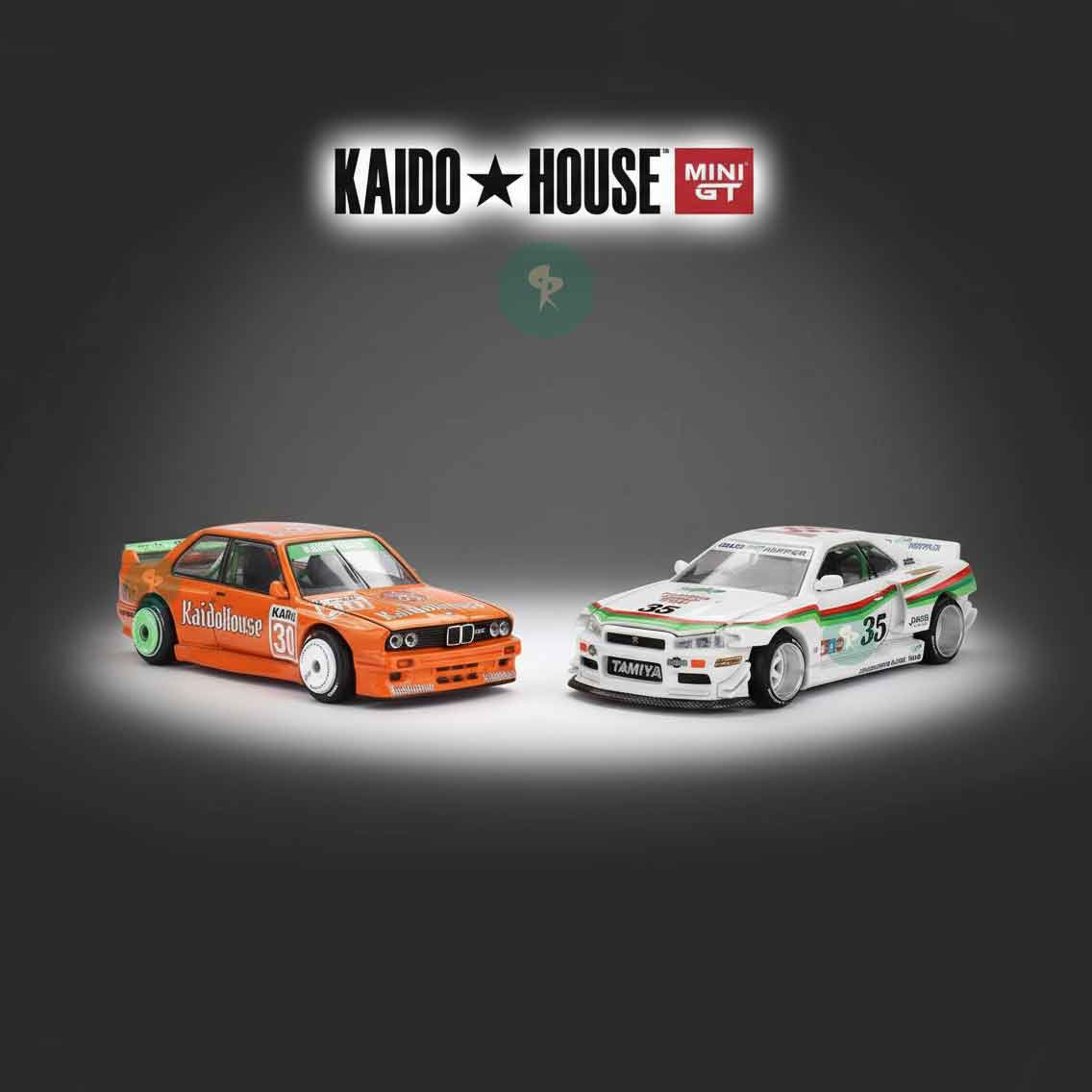 Kaido House Mini GT die-cast collection featuring orange BMW M3 and white Nissan Skyline Grasshopper, spotlight display for Kaido House category at RACEiN PARC
