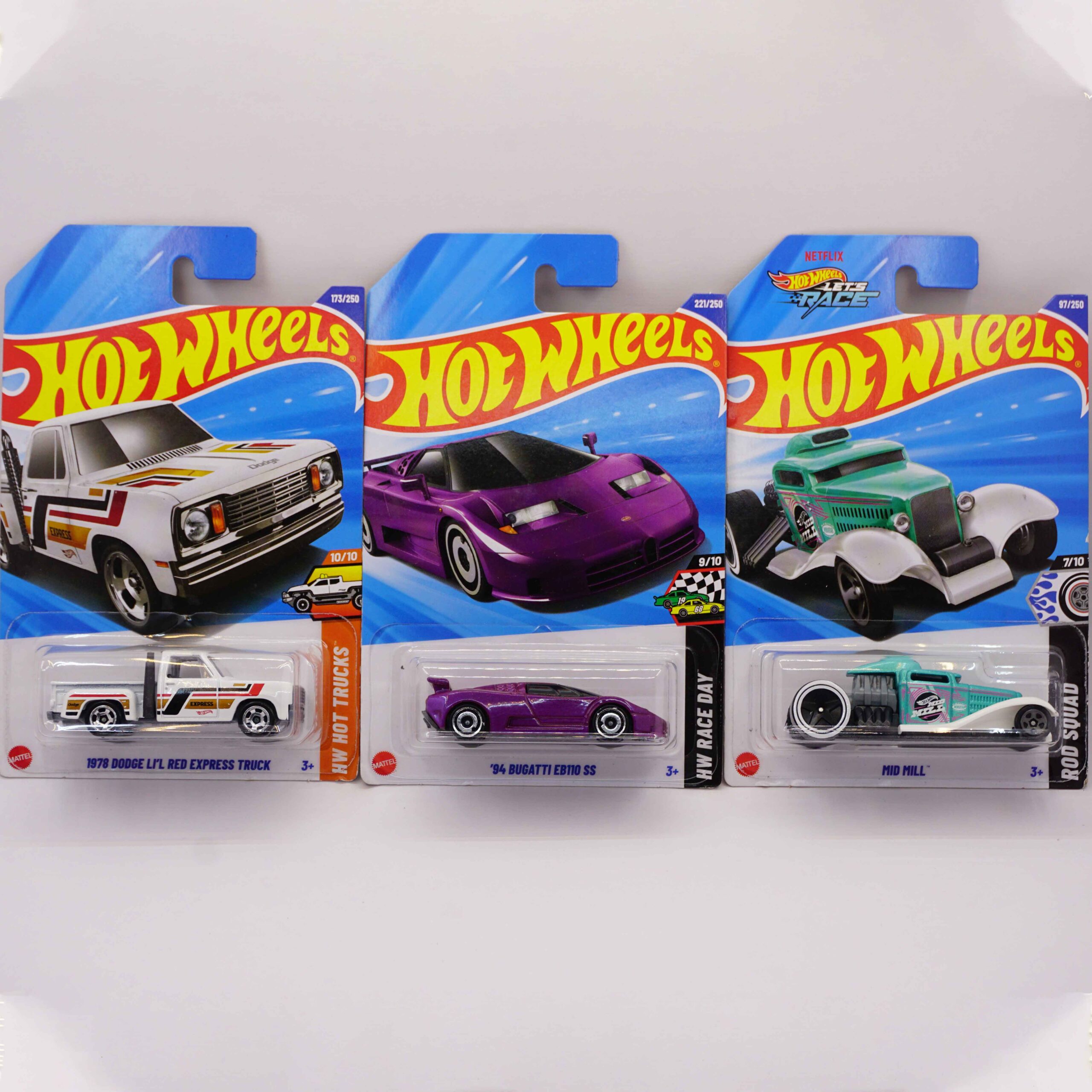 Hot Wheels Mainlines die-cast cars, featuring purple '94 Bugatti EB110 SS, white 1978 Dodge Li'l Red Express Truck, and green Mid Mill fantasy, 2025 releases at RACEiN PARC