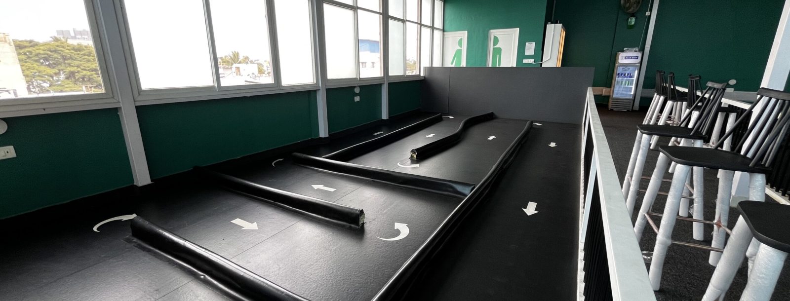 Beginner learning RC racing on an indoor track at RACEiN PARC Bengaluru